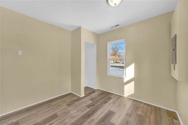 unfurnished room featuring light wood-type flooring