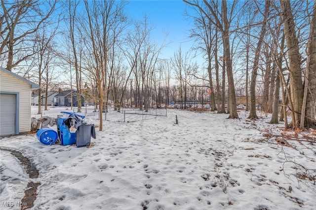 view of yard layered in snow