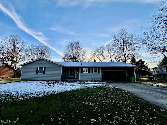 ranch-style home featuring a carport and a front lawn