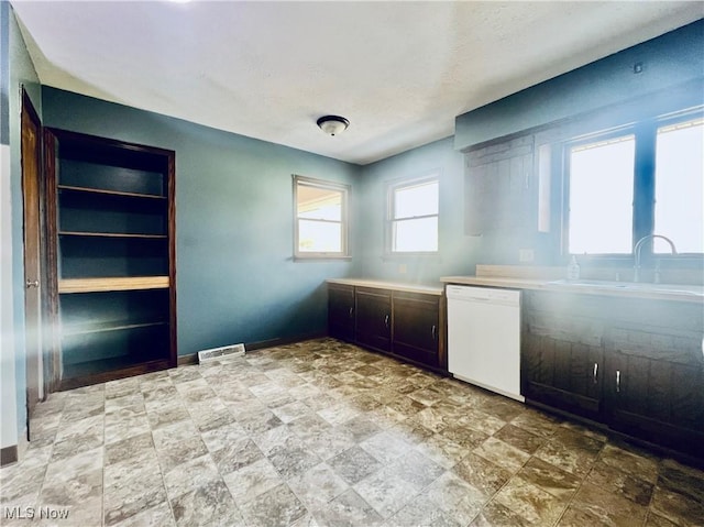 interior space featuring sink and white dishwasher