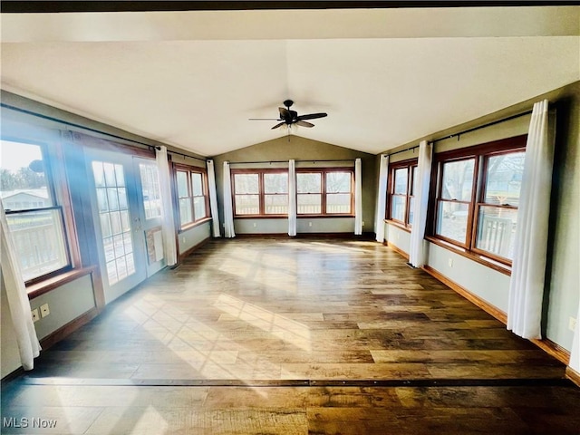 unfurnished sunroom with lofted ceiling and ceiling fan