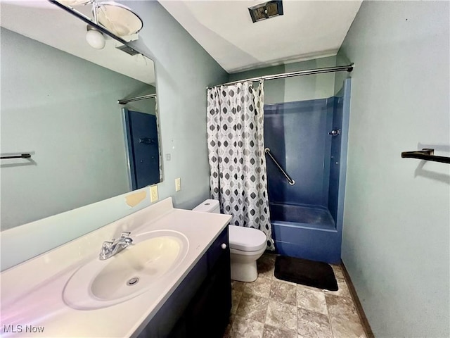 full bathroom featuring shower / tub combo with curtain, vanity, and toilet