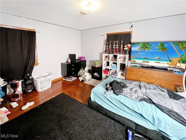 bedroom featuring wood-type flooring