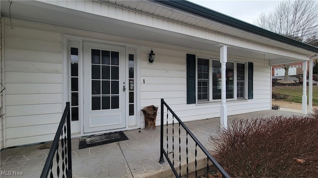 doorway to property featuring a porch