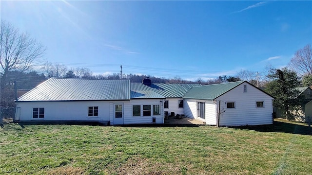 rear view of house with a lawn