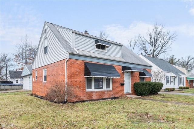 view of front facade featuring a garage and a front lawn