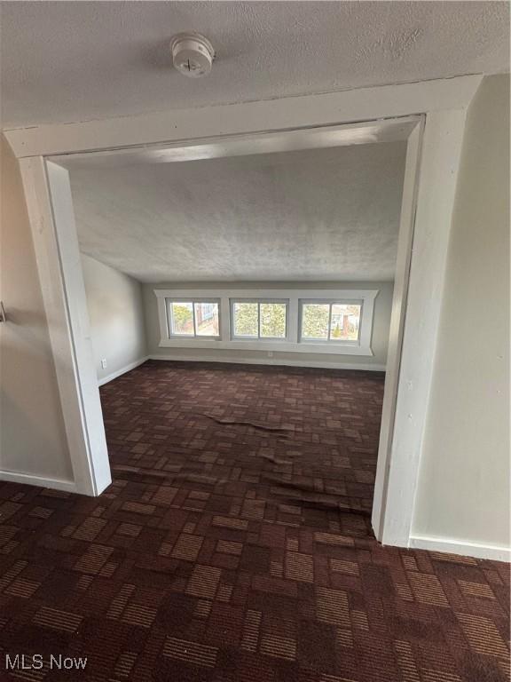 empty room with a textured ceiling