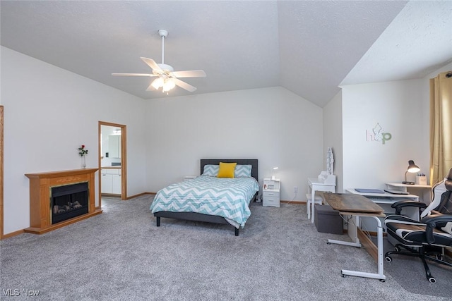 bedroom featuring lofted ceiling, ceiling fan, a textured ceiling, and carpet flooring