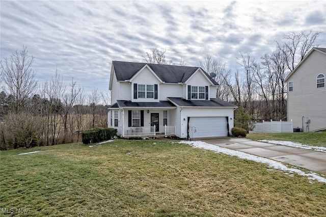 view of property featuring a garage, a front lawn, and covered porch