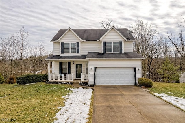 view of front facade featuring a garage, a front yard, and covered porch