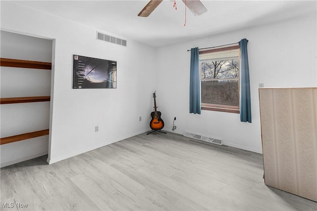 unfurnished bedroom with ceiling fan and light hardwood / wood-style flooring