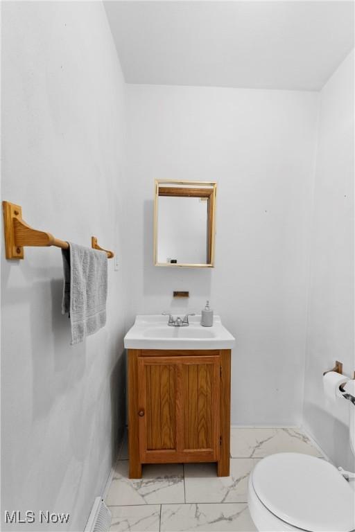 bathroom with vanity and toilet