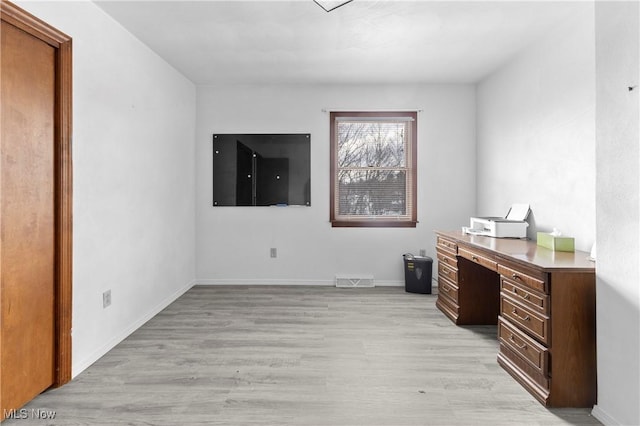 home office with light wood-type flooring