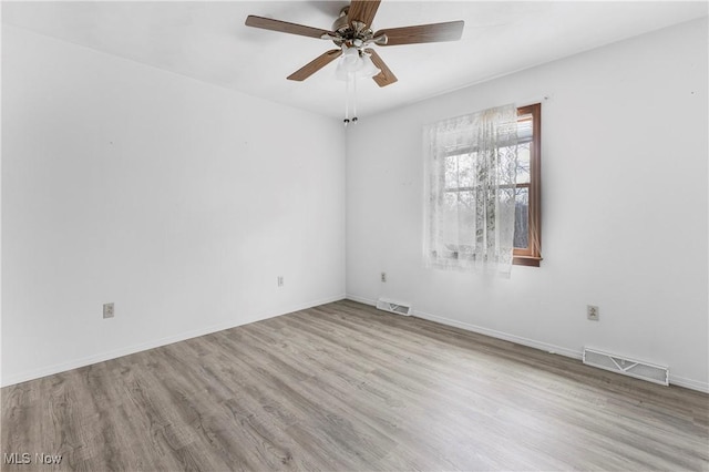 unfurnished room featuring ceiling fan and light hardwood / wood-style flooring