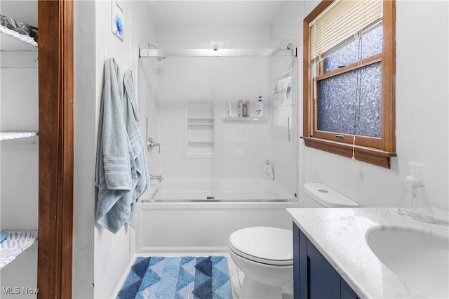 full bathroom featuring vanity, toilet, and combined bath / shower with glass door