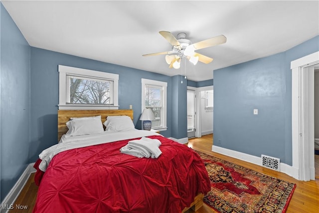 bedroom featuring hardwood / wood-style floors and ceiling fan