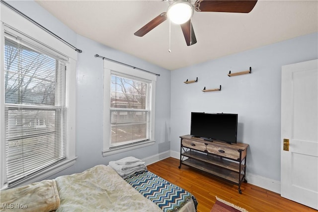 bedroom featuring hardwood / wood-style flooring and ceiling fan