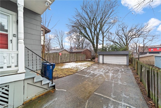 view of patio / terrace featuring a garage and an outdoor structure