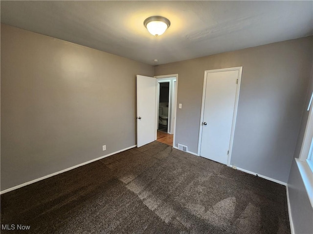 unfurnished bedroom with carpet flooring