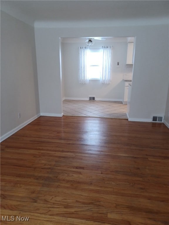 empty room featuring dark hardwood / wood-style floors