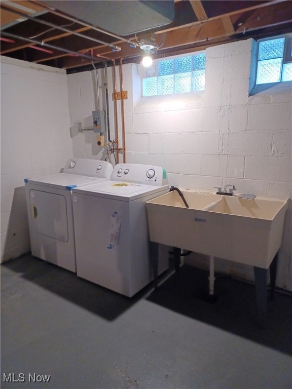 laundry room featuring sink and washer and dryer