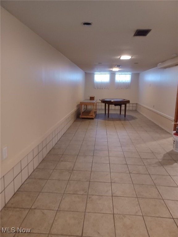 basement with light tile patterned floors