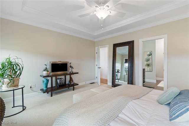 carpeted bedroom with crown molding and ceiling fan