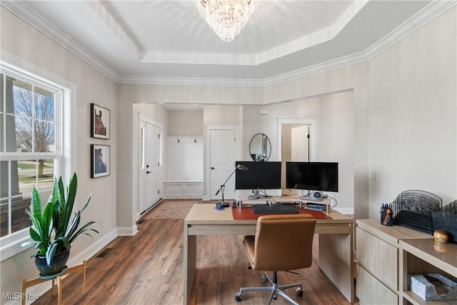 office area with a chandelier, a tray ceiling, and dark hardwood / wood-style flooring