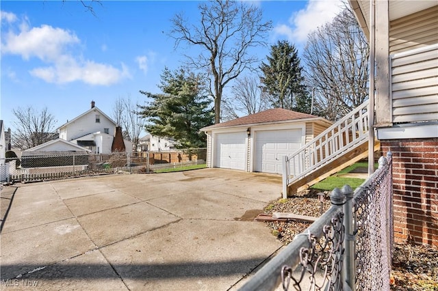 view of property exterior featuring an outbuilding and a garage