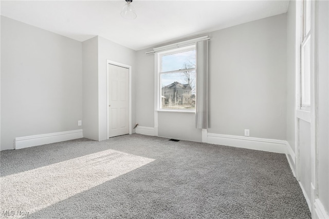 unfurnished bedroom featuring carpet