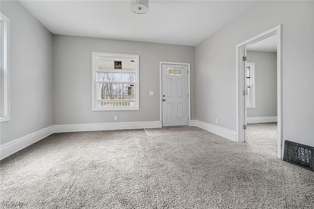 unfurnished room with carpet floors