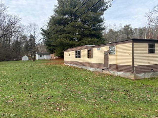 view of home's exterior with a lawn