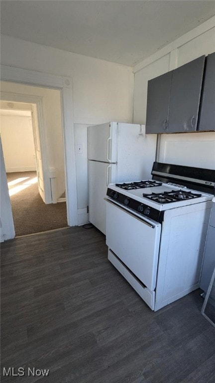 kitchen featuring white gas range and dark hardwood / wood-style floors