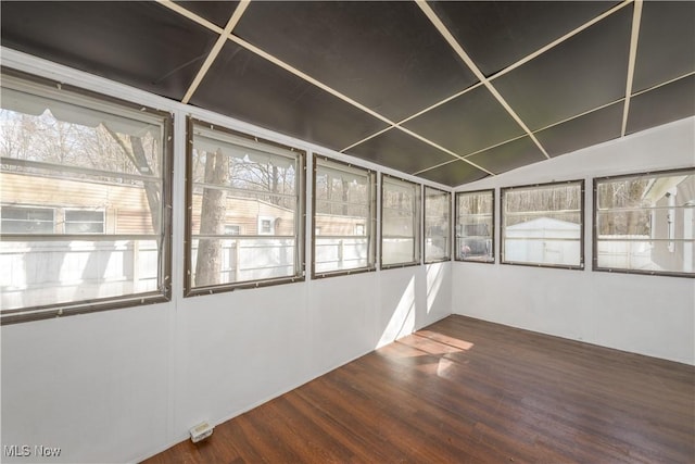 unfurnished sunroom with vaulted ceiling