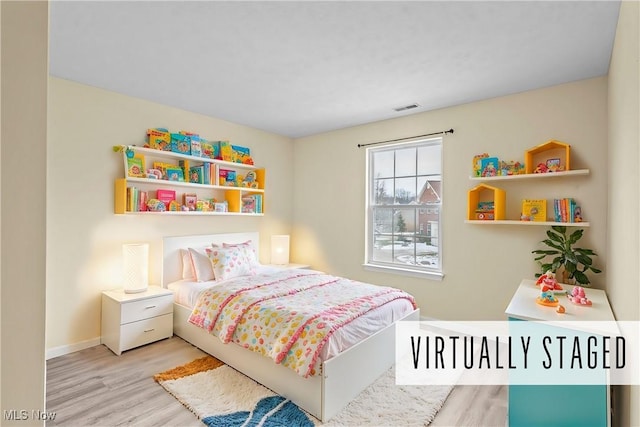 bedroom featuring light hardwood / wood-style floors