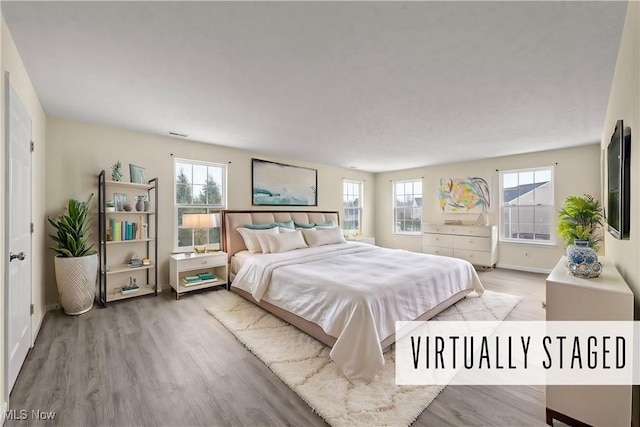 bedroom featuring light hardwood / wood-style flooring