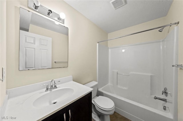 full bathroom featuring vanity, shower / bathtub combination, and toilet