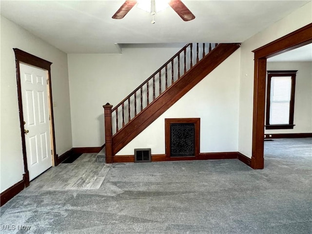 interior space with ceiling fan