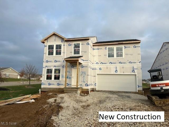 unfinished property with a garage