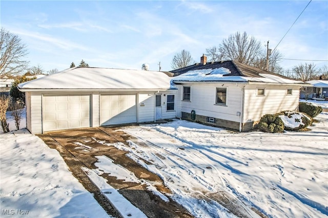 ranch-style house featuring a garage