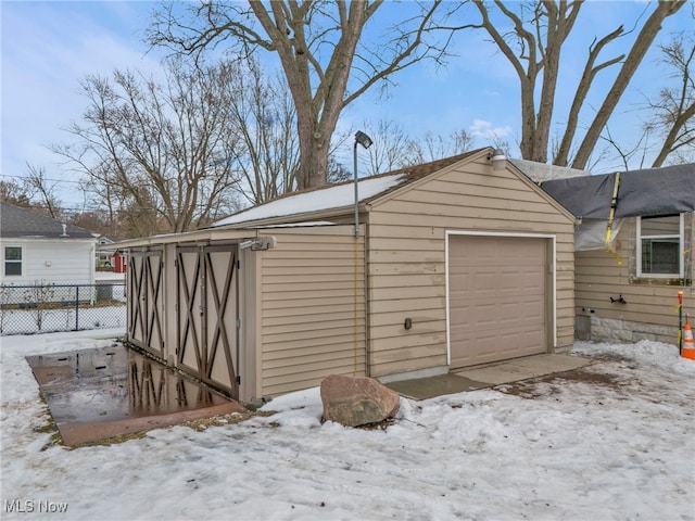 view of snow covered garage