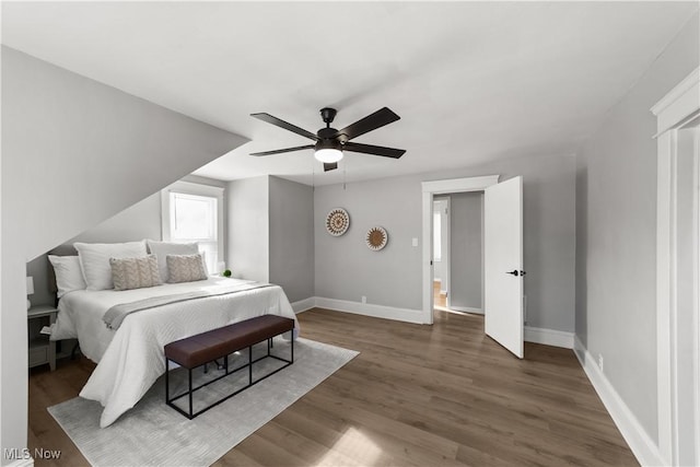 bedroom featuring dark wood-type flooring and ceiling fan