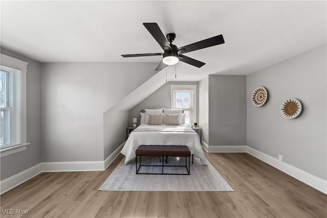 unfurnished bedroom with ceiling fan and light hardwood / wood-style flooring