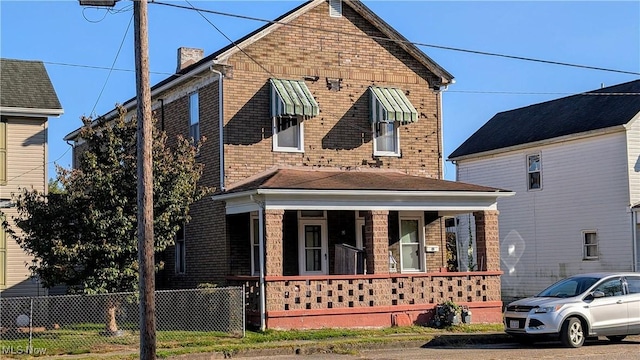 view of property with covered porch