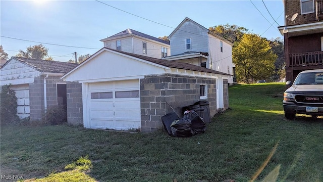 garage featuring a yard