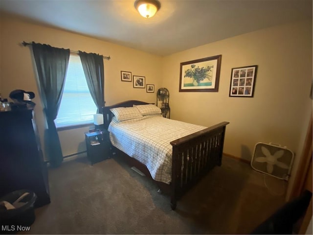 carpeted bedroom featuring a baseboard radiator