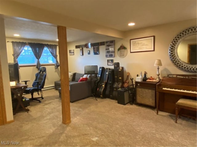 carpeted office featuring a baseboard heating unit