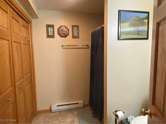 bathroom featuring a baseboard radiator and a shower with shower curtain