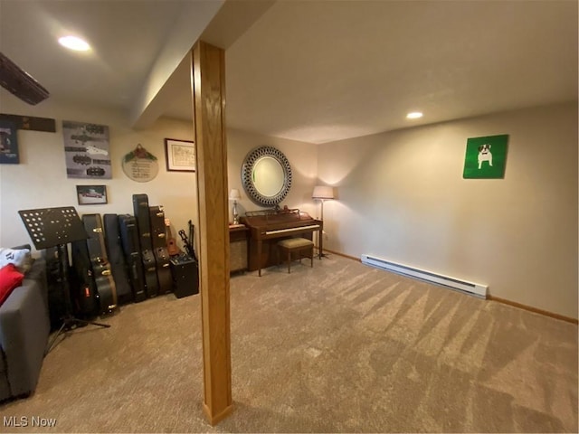 interior space featuring light carpet and a baseboard heating unit