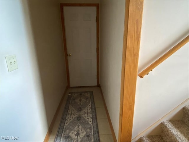 corridor featuring light tile patterned flooring